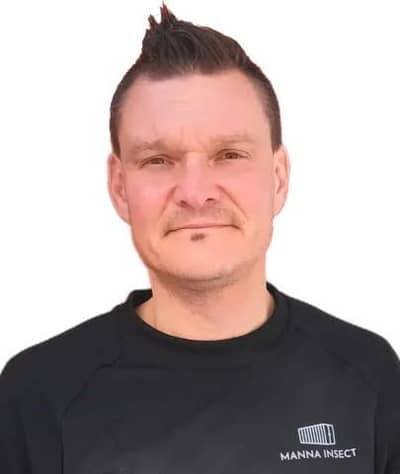 Toni Marjanen wearing a black Manna Insect shirt.